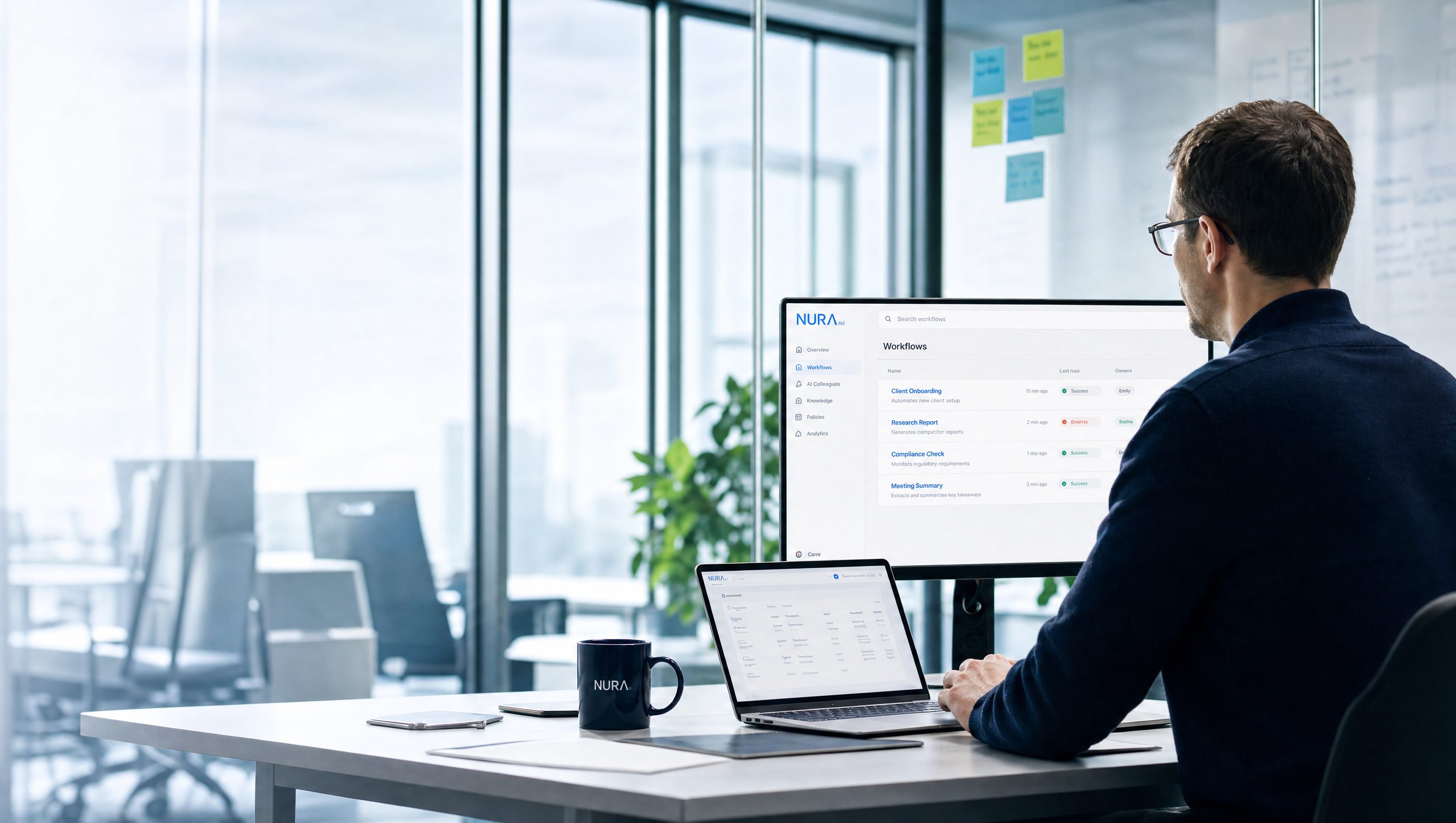 A NURA AI operator reviewing the governed workflow console on screen in a modern office